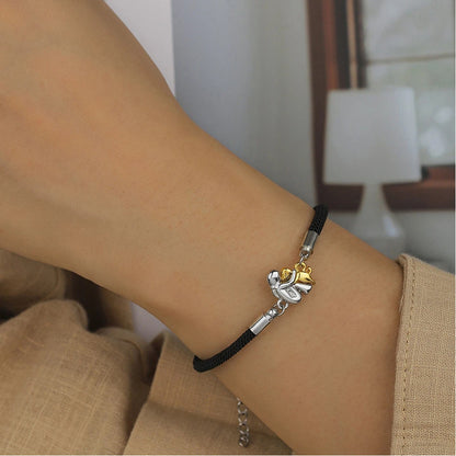 A little girl and a dog embrace earrings